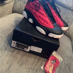 Red and Black Sneakers with Extra Laces. Air Jordan 13 retro low.